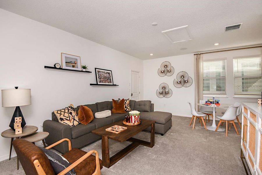 Furnished interior view inside a new home in Harvest at Ovation, Winter Garden (Image 4).