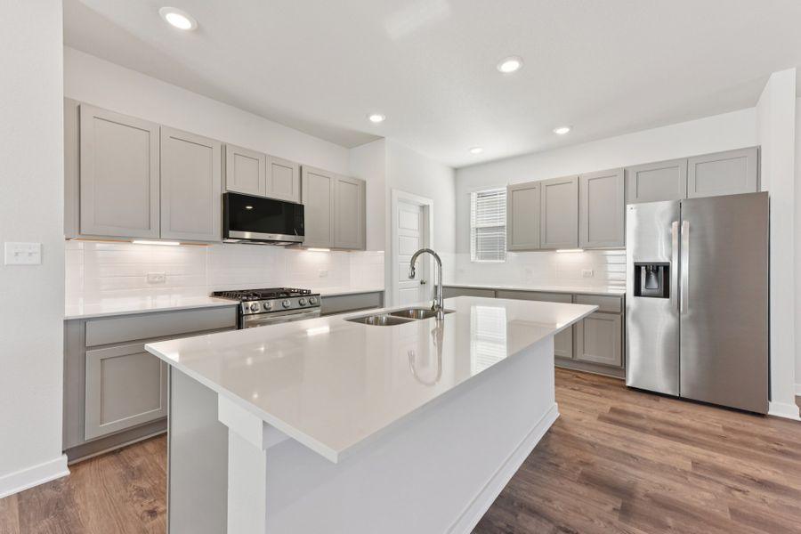 A kitchen with white cabinets. A kitchen with white cabinets.