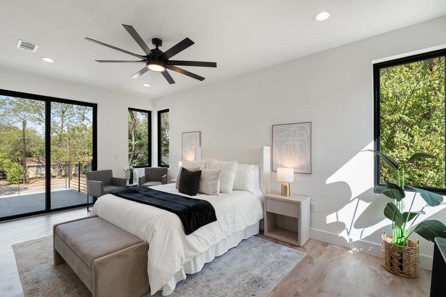Bedroom with recessed lighting, wood finished floors, multiple windows, access to exterior, and ceiling fan