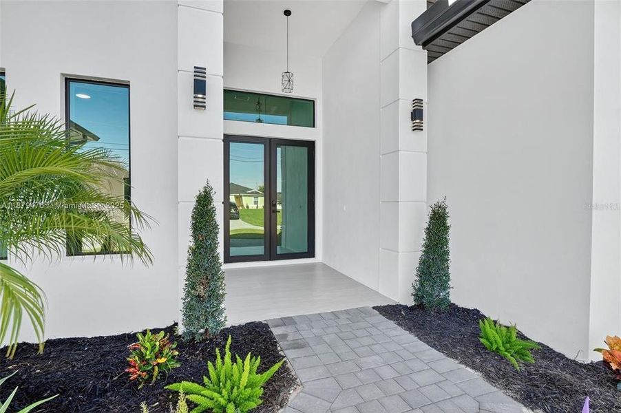 Front exterior of a new home in , Cape Coral, FL, highlighting curb appeal (Image 22).