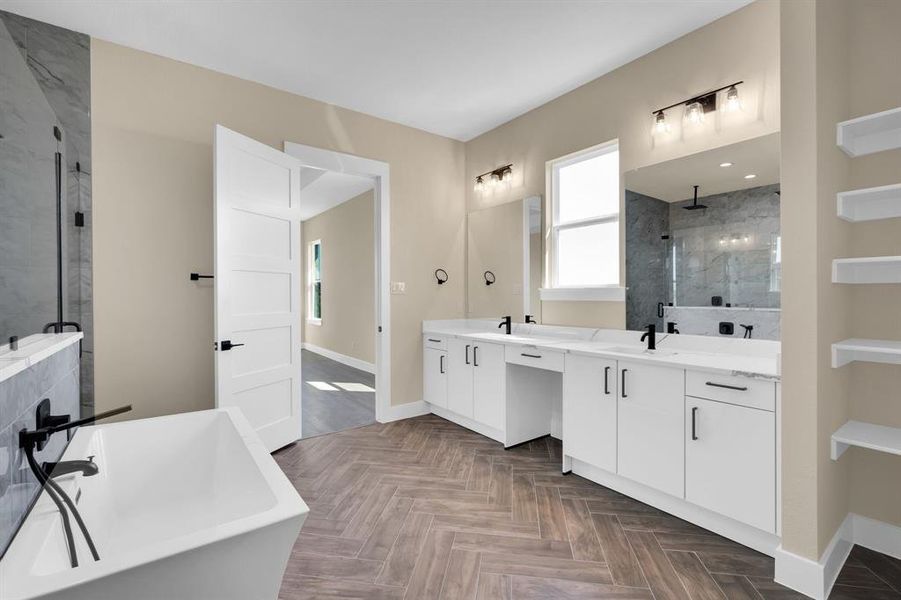 Bathroom featuring parquet flooring, vanity, and shower with separate bathtub