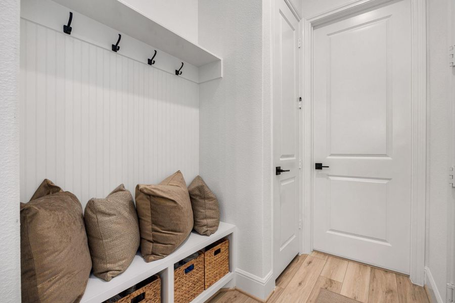 A functional mudroom featuring built-in storage and easy access to the main living areas.