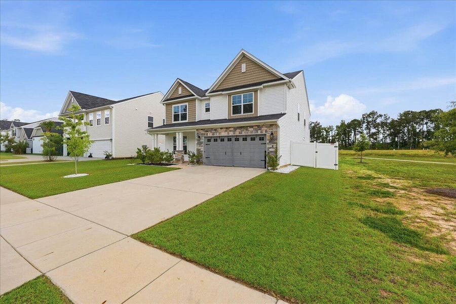Front exterior of a new home in , Ridgeville, SC, highlighting curb appeal (Image 29). Front exterior of a new home in , Ridgeville, SC, highlighting curb appeal (Image 29).