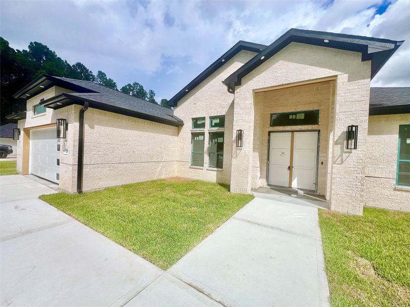 Front exterior of a new home in , Dayton, TX, highlighting curb appeal (Image 6).