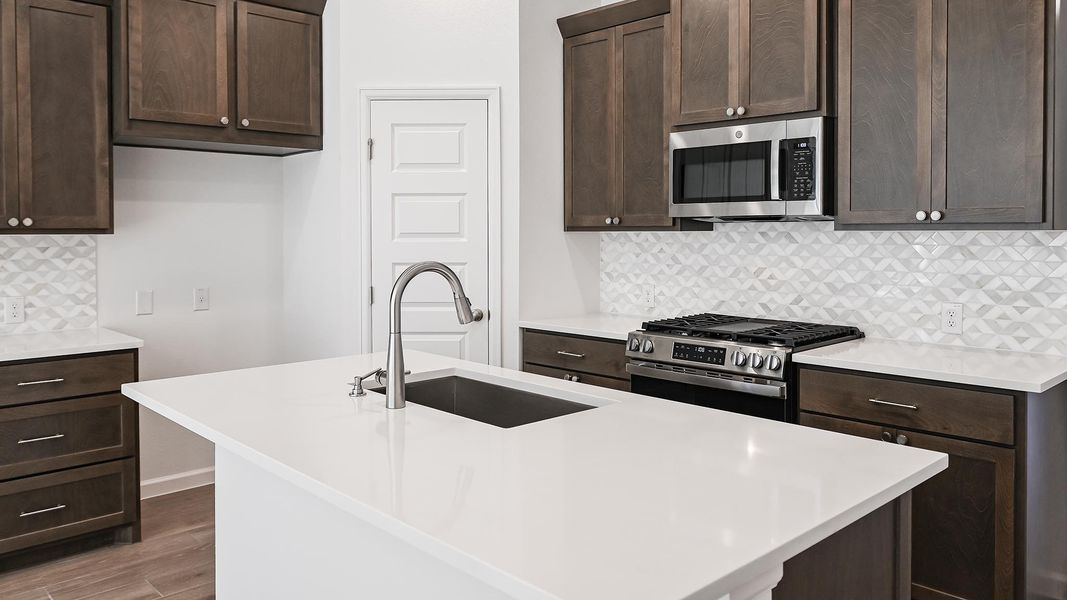 Furnished interior view inside a new home in Crosswinds 40', Kyle (Image 4).