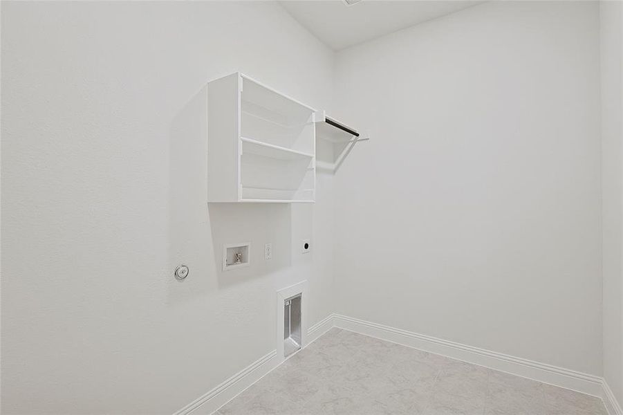 Laundry area with gas dryer hookup, washer hookup, and electric dryer hookup