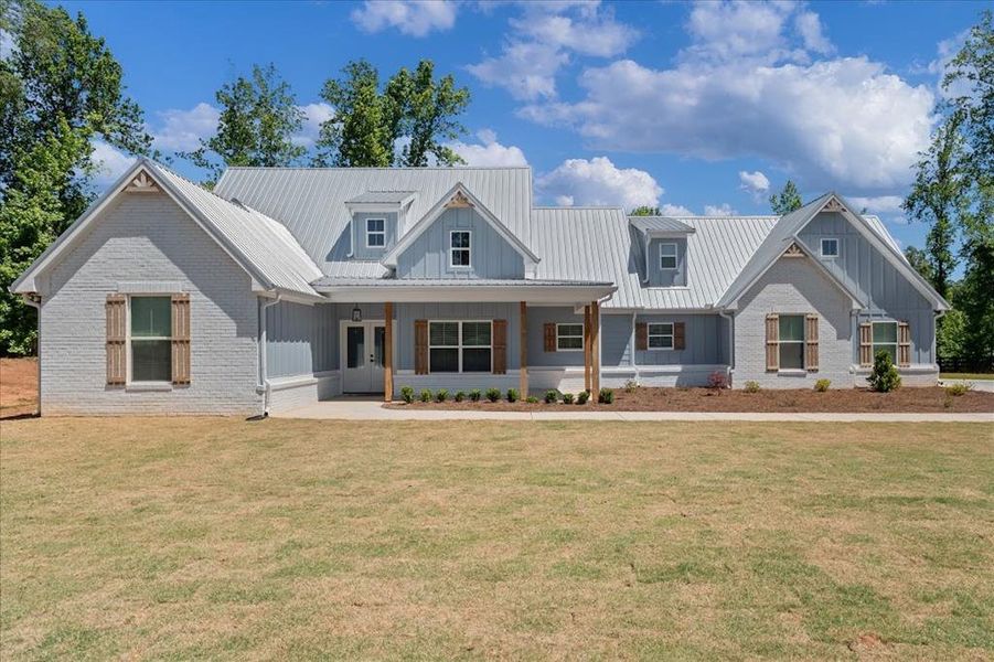 Front exterior of a new home in , Carrollton, GA, highlighting curb appeal (Image 14).