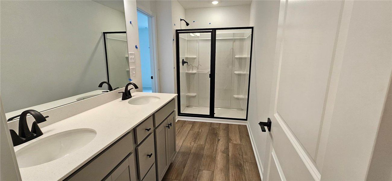This bathroom offers a double vanity with ample co
