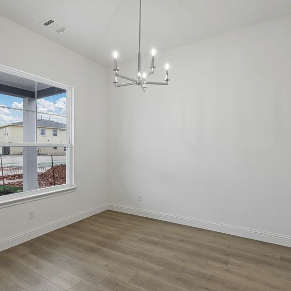 Representative furnished interior of a home built from the The Emery by Village Homes in Walsh, Aledo (Image 8).