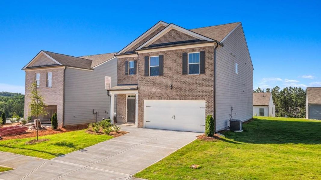 Front exterior of a new home in Pointe Park, Union City, GA, highlighting curb appeal (Image 2). Front exterior of a new home in Pointe Park, Union City, GA, highlighting curb appeal (Image 2).