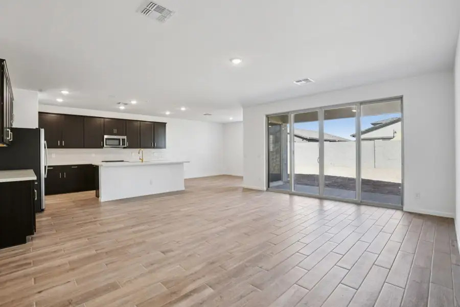 Great room & Kitchen - Stonebridge Model Home. Finishes and options may vary by community