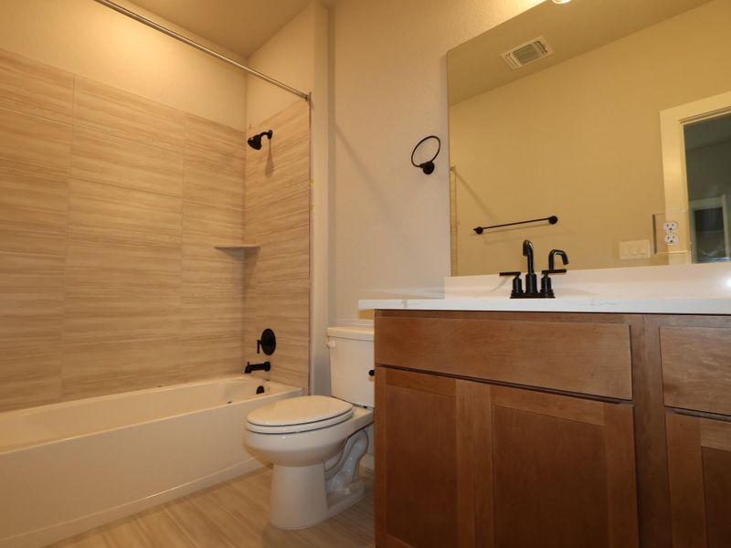 Furnished interior view inside a new home in Heritage, Dripping Springs (Image 8).