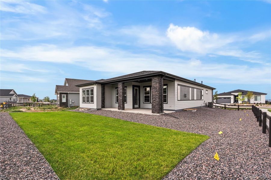 Front exterior of a new home in Hilltop at Inspiration, Aurora, CO, highlighting curb appeal (Image 1).