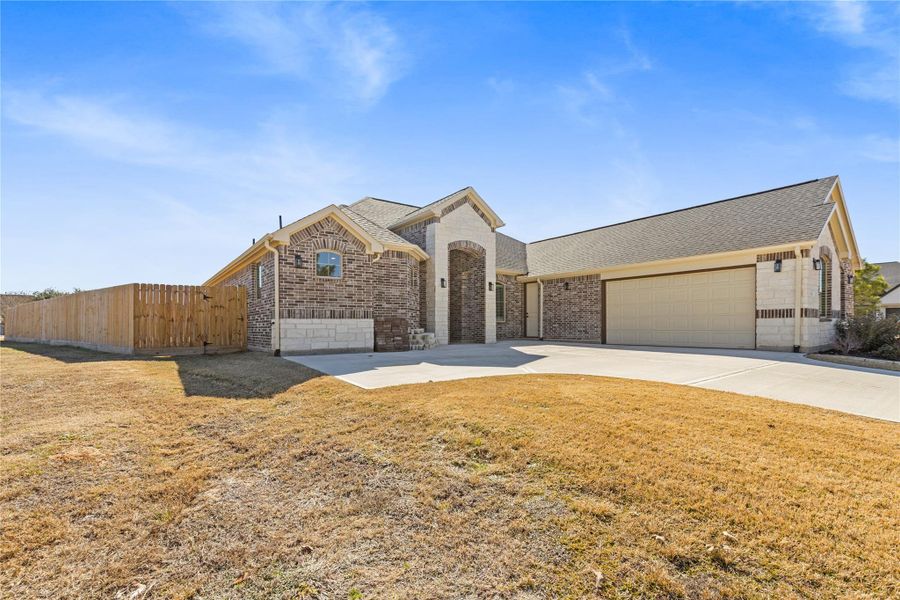 Front exterior of a new home in Bentwater, Montgomery, TX, highlighting curb appeal (Image 2).
