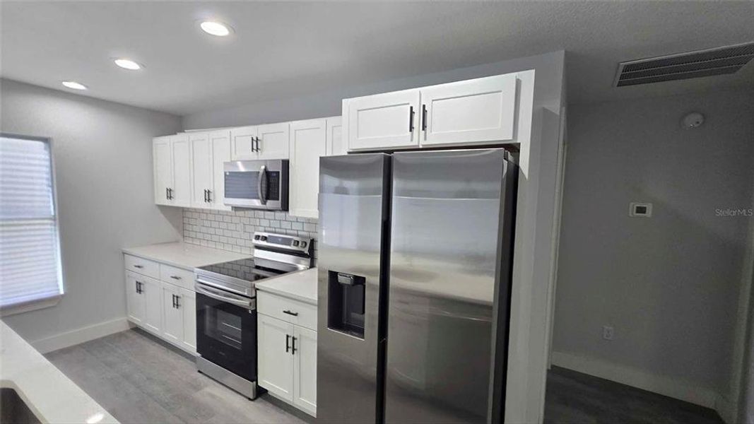 Furnished interior view inside a new home in , Dunnellon (Image 7).