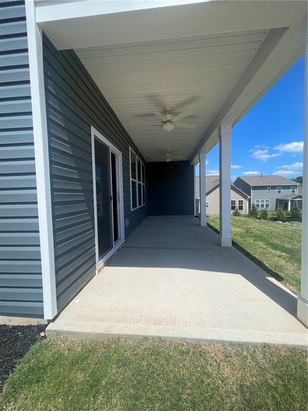 Exterior details and patio area of a home in Springwood Grove, Central (Image 4).