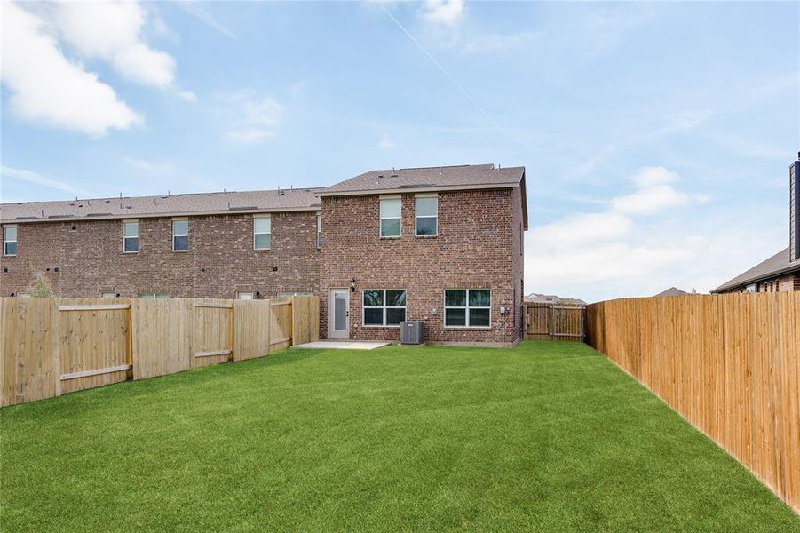 This is an example of the backyard at 497 MB's Way. All backyards are fenced, landscaped, and have a concrete patio. This is an example of the backyard at 497 MB's Way. All backyards are fenced, landscaped, and have a concrete patio.