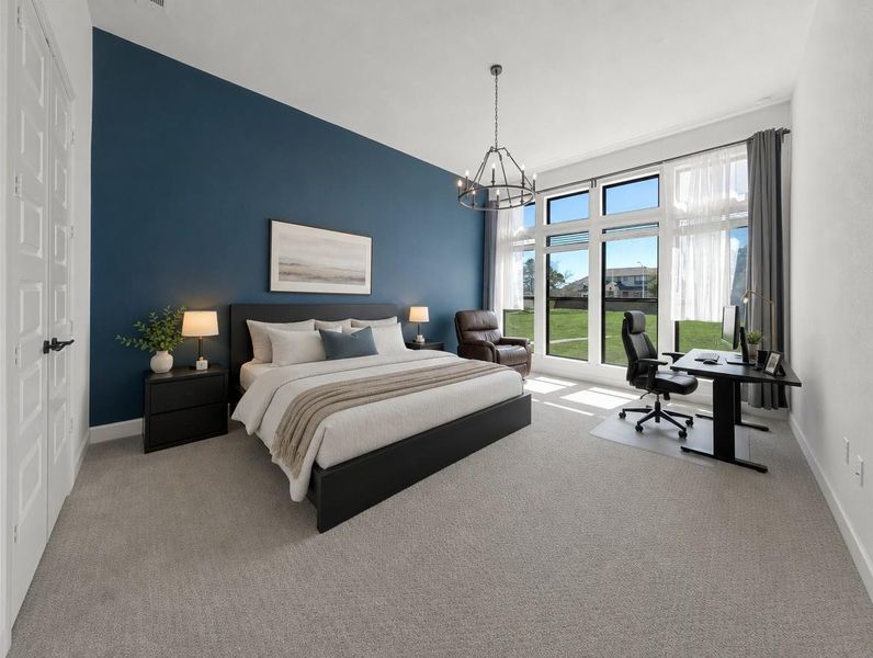 Natural illumination fills this generously proportioned bedroom, featuring a dedicated workspace and large windows overlooking green space. Natural illumination fills this generously proportioned bedroom, featuring a dedicated workspace and large windows overlooking green space.