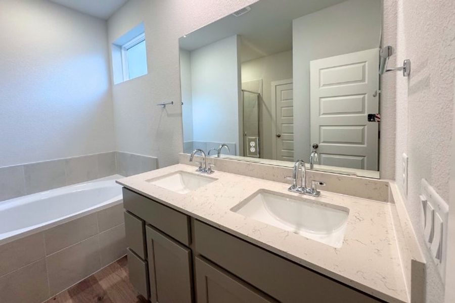 A bathroom with a large mirror. A bathroom with a large mirror.