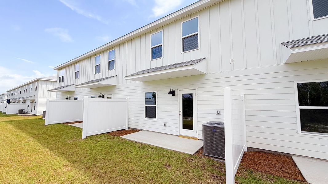 Exterior details and patio area of a home in Salt Creek Townhomes at Mexico Beach, Mexico Beach (Image 20).