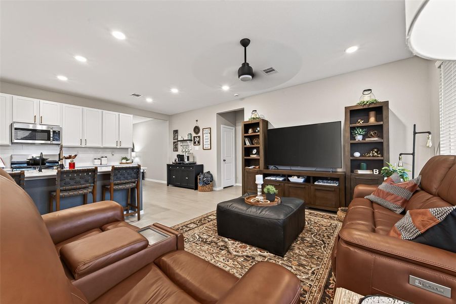 Spacious family room with recessed lighting and an open layout. Spacious family room with recessed lighting and an open layout.