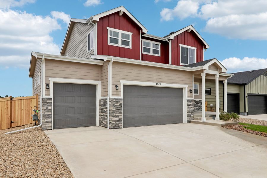 Front exterior of a new home in Granary, Johnstown, CO, highlighting curb appeal (Image 21). Front exterior of a new home in Granary, Johnstown, CO, highlighting curb appeal (Image 21).