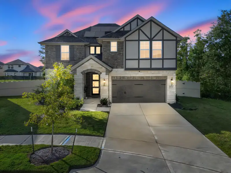 Front exterior of a new home in Harper's Preserve - Classic Series, Conroe, TX, highlighting curb appeal (Image 1). Front exterior of a new home in Harper's Preserve - Classic Series, Conroe, TX, highlighting curb appeal (Image 1).