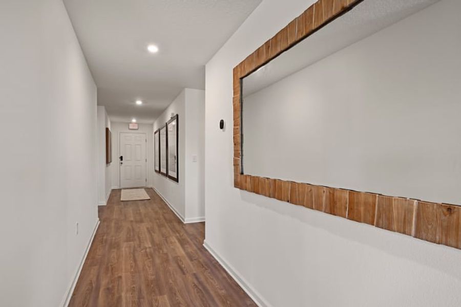 A hallway with white walls. A hallway with white walls.