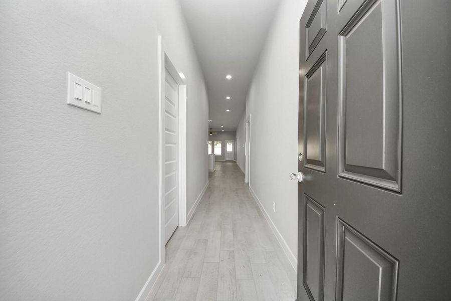 As you step into the threshold of this luxurious home, you'll soon be welcomed by an elegant glass door (to be installed). Inside, soaring ceilings amplify the spaciousness, while the refined wood-look tile flooring and oversized baseboards exude sophistication and charm. Sample photo of completed home with similar floor plan. Actual colors and selections may vary.