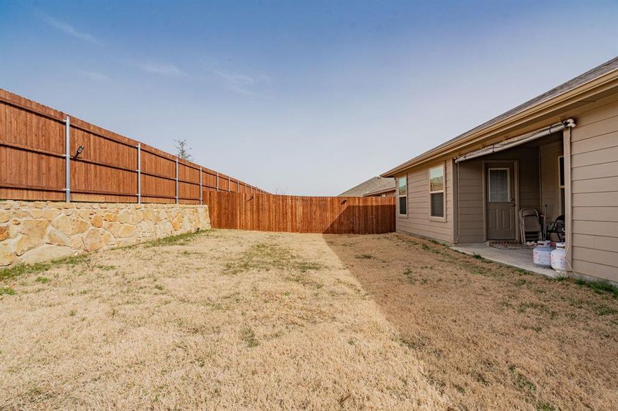 View of yard with a patio area and a fenced backyard