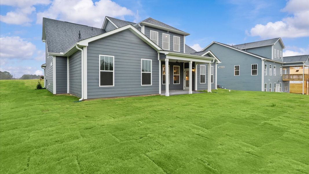 Accomplished exterior with a spacious rear porch that blends comfort and style