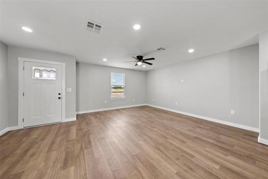 Foyer featuring recessed lighting, a ceiling fan, and light wood-style flooring Foyer featuring recessed lighting, a ceiling fan, and light wood-style flooring