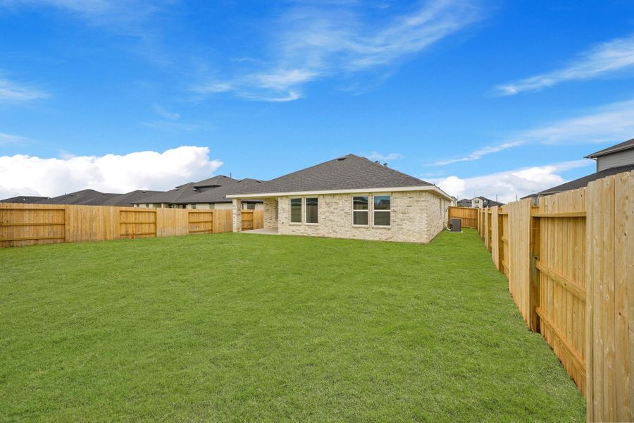 Exterior details and patio area of a home in Sunterra, Katy (Image 19).