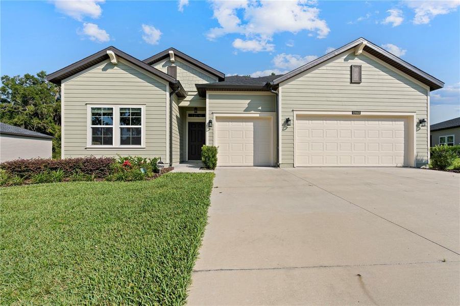 Front exterior of a new home in Grand Park North, Dunnellon, FL, highlighting curb appeal (Image 22).
