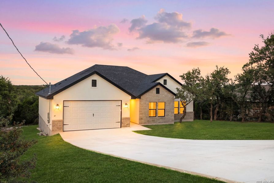 Front exterior of a new home in , Canyon Lake, TX, highlighting curb appeal (Image 1). Front exterior of a new home in , Canyon Lake, TX, highlighting curb appeal (Image 1).