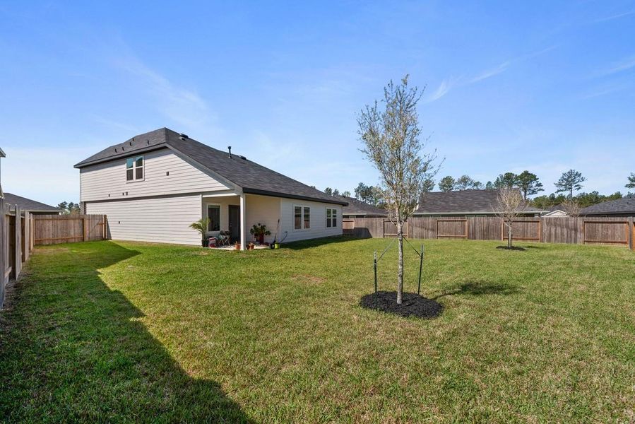 What a yard! You can't find this sized lot in many new houses!