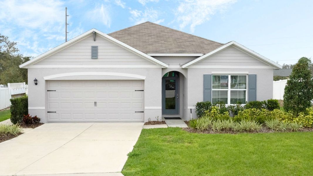 Front exterior of a new home in Wynwood, Ocoee, FL, highlighting curb appeal (Image 1). Front exterior of a new home in Wynwood, Ocoee, FL, highlighting curb appeal (Image 1).