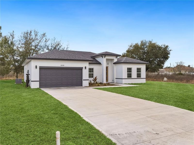 Front exterior of a new home in , Ocala, FL, highlighting curb appeal (Image 20).