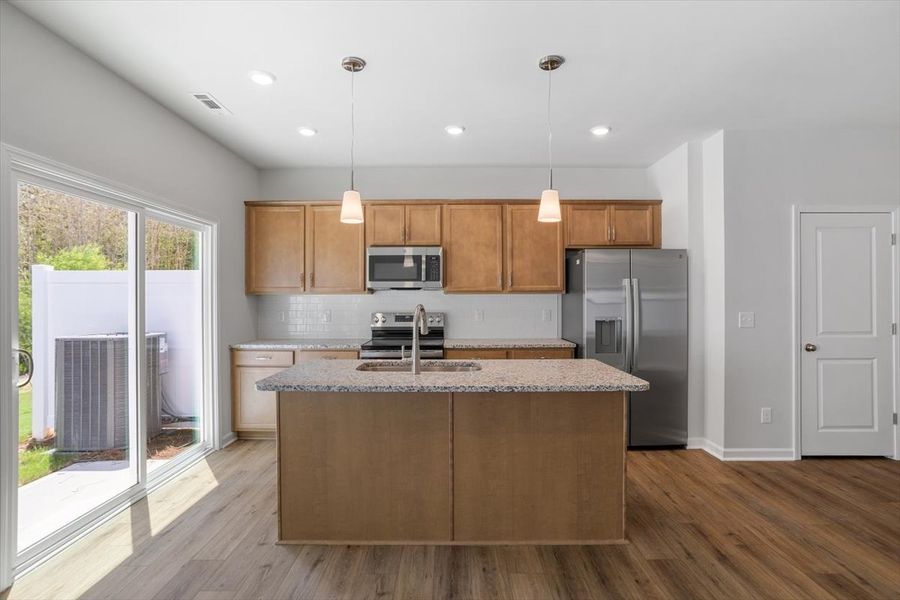 Furnished interior view inside a new home in West Main Townhomes, Sanford (Image 7).