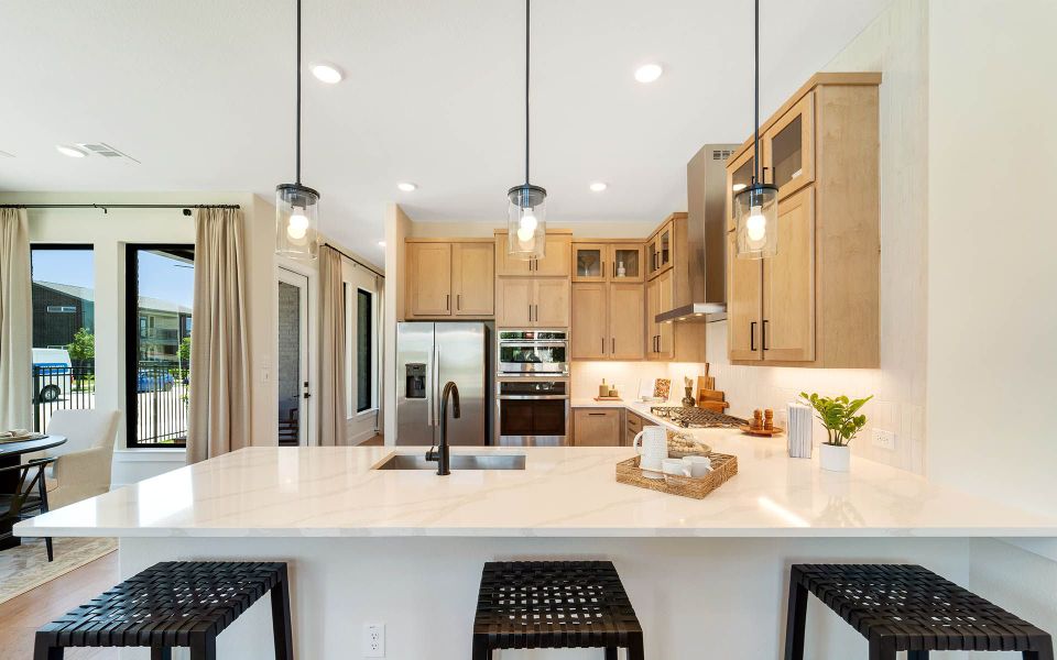 Representative furnished interior of a home built from the Rainier by CastleRock Communities in The Summit at Center Stage, Keller (Image 8).