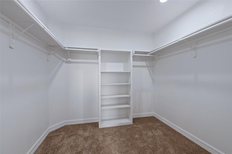 Primary bedroom walk-in closet.