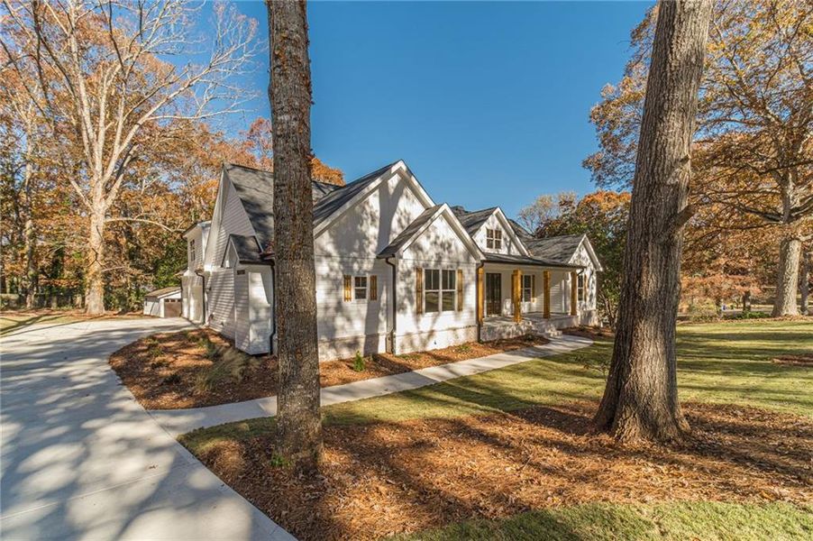 Front exterior of a new home in , Monroe, GA, highlighting curb appeal (Image 30).
