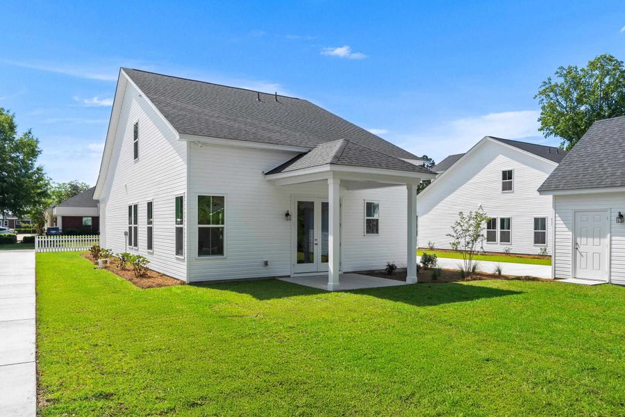 Exterior details and patio area of a home in Downtown Loris Homes, Loris (Image 28).