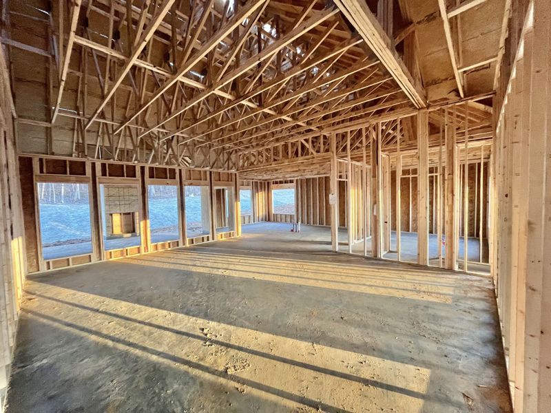 From great room entrance looking across to kitchen. Note the 5 extra large windows!