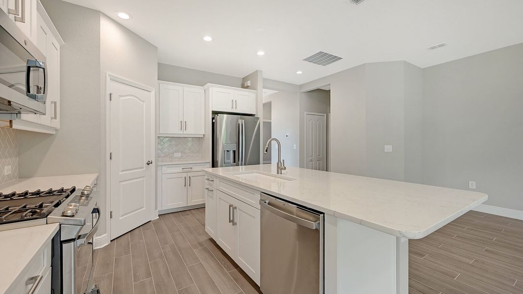 Furnished interior view inside a new home in Boca Royale Golf and Country Club at Wellen Park, Englewood (Image 12).