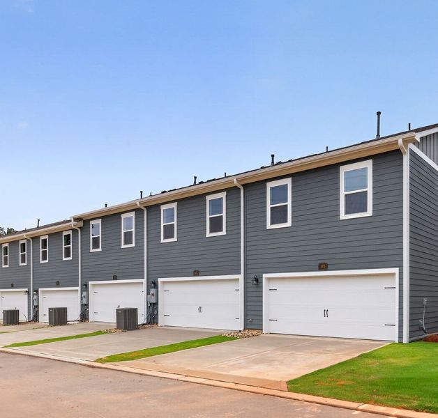 Front exterior of a new home in Hardy Pond Townhomes, Rock Hill, SC, highlighting curb appeal (Image 1). Front exterior of a new home in Hardy Pond Townhomes, Rock Hill, SC, highlighting curb appeal (Image 1).
