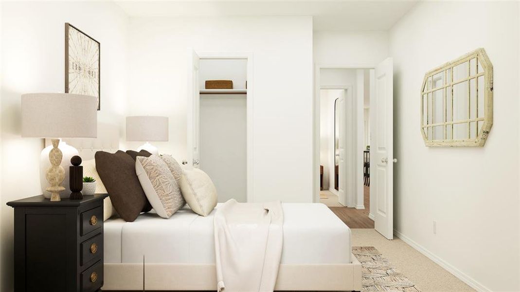 Bedroom featuring a closet and light colored carpet