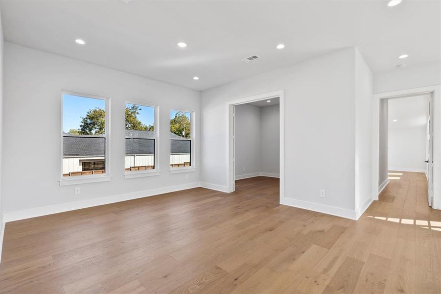 Unfurnished room with light hardwood / wood-style flooring