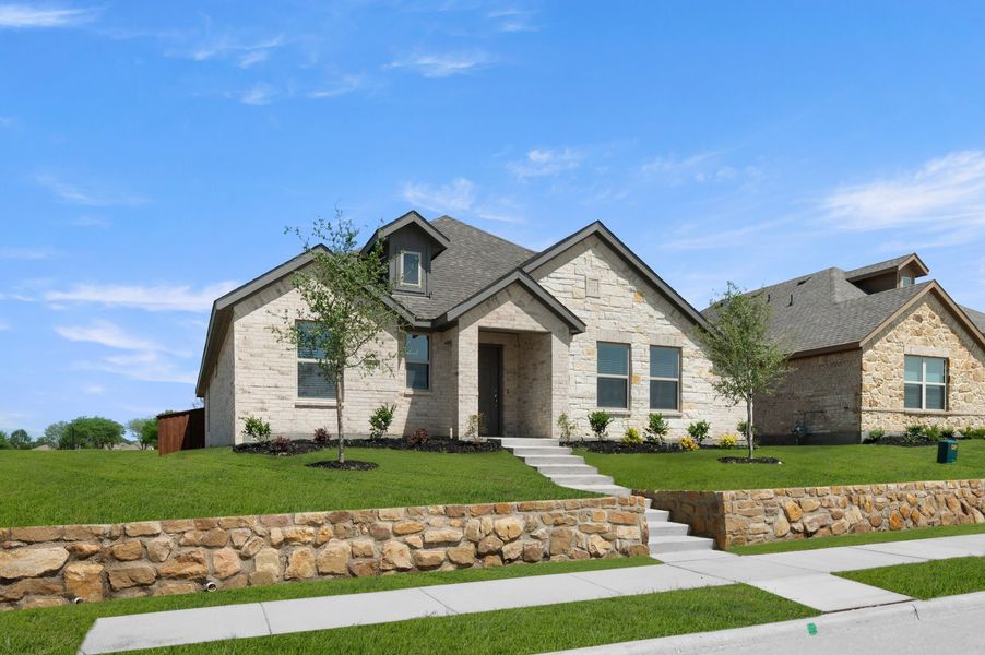 Front exterior of a new home in Redden Farms, Midlothian, TX, highlighting curb appeal (Image 2). Front exterior of a new home in Redden Farms, Midlothian, TX, highlighting curb appeal (Image 2).
