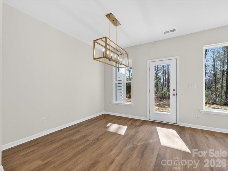 Courtyard door leads out to your covered patio with view to the woods. Courtyard door leads out to your covered patio with view to the woods.